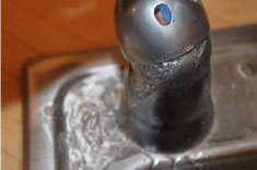 Plumber Replacing Broken Faucet in Hampton VA
