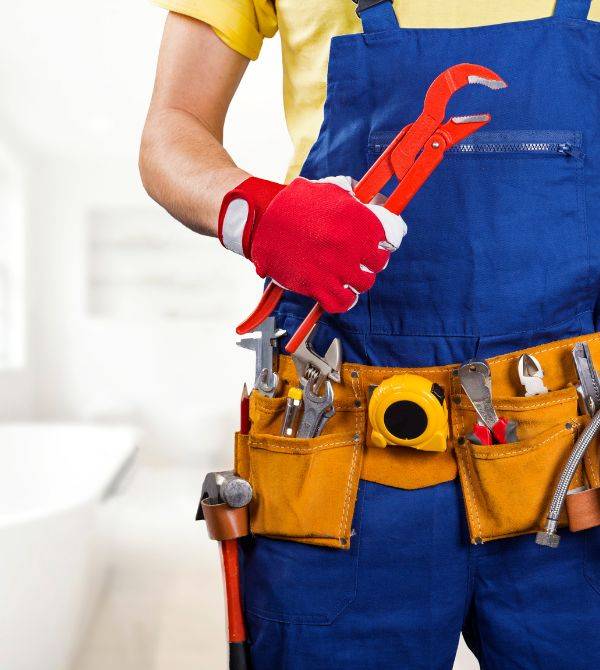 Plumber standing in bathroom