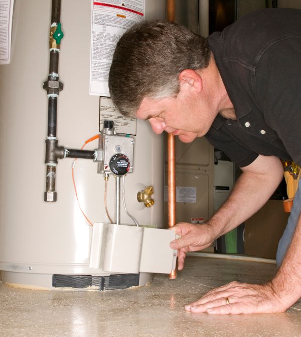 Plumber installing water heater