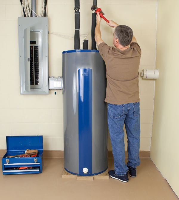 Plumber repairing hot water heater