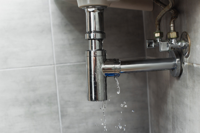 Damaged steel pipe in bathroom
